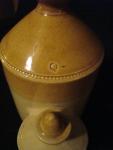 Chicken waterer, stoneware, Bristol glaze, orange glaze, molded, one-piece, with hood, with finial, Mark:  'Q'